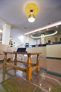 a pool table in the middle of a room at Theofilos Classic Hotel in Petra