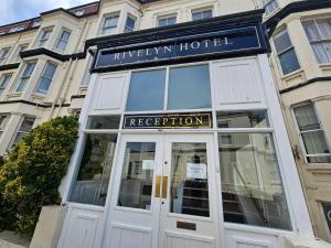 a hotel with a sign above a door at Rivelyn Hotel Bar & Restaurant in Scarborough