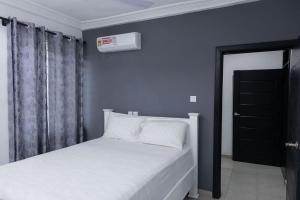 Ένα ή περισσότερα κρεβάτια σε δωμάτιο στο Richview Luxury Apartment