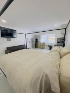 a bedroom with a large bed in a room at New Mid Miami Beach apt free parking and beach access in Miami Beach