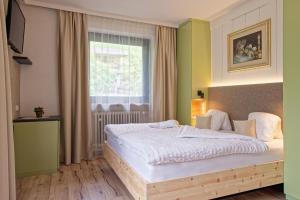 Postel nebo postele na pokoji v ubytování Bergchalet Hotel Reinerhof