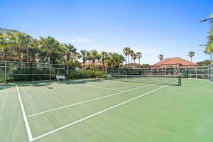 an image of a tennis court with palm trees at La Valencia Villas in Rosemary Beach