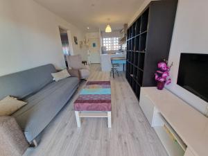 a living room with a couch and a table at Del Rodriguez in Cunit