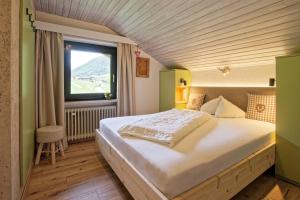 Postel nebo postele na pokoji v ubytování Bergchalet Hotel Reinerhof