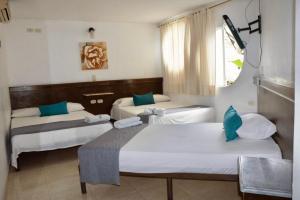 Hotel Mar Azul Neiva客房内的一张或多张床位