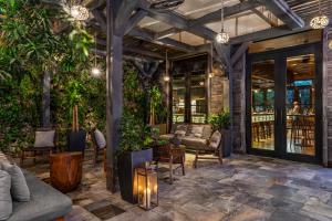 a patio with plants and furniture in a building at EAST Miami in Miami