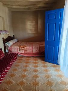 Кровать или кровати в номере Maison d'hôte traditionnelle