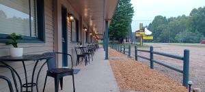 a row of tables and chairs outside of a building at TeePee Room 16-Newly Renovated in Roscommon