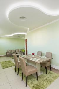 a dining room with a table and chairs at Apartments Aleksandra in Podgorica