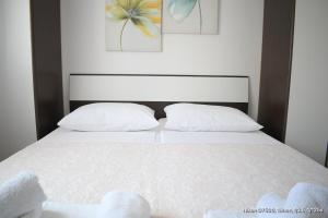 Postel nebo postele na pokoji v ubytování Apartmani Marić