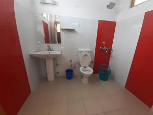 a bathroom with a toilet and a sink at Reeyork House - By Konchok a native Ladakhi in Leh