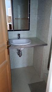 a bathroom with a sink and a mirror at Apartement Coeur Nice Ville ! Zone Touristique ! in Nice