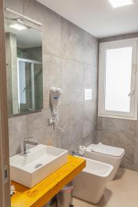 Koupelna v ubytování Isgrò Rooms