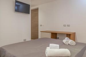 Postel nebo postele na pokoji v ubytování Isgrò Rooms