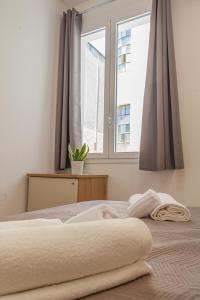 Postel nebo postele na pokoji v ubytování Isgrò Rooms