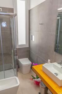 Koupelna v ubytování Isgrò Rooms
