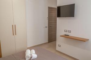 TV a/nebo společenská místnost v ubytování Isgrò Rooms
