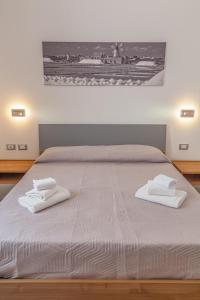 Postel nebo postele na pokoji v ubytování Isgrò Rooms