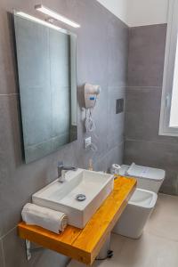 Koupelna v ubytování Isgrò Rooms
