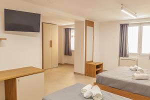 Postel nebo postele na pokoji v ubytování Isgrò Rooms