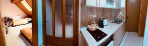 a bathroom with a sink and a bed in a room at Apartman HAN in Sarajevo +39 photos