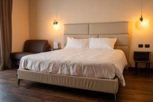 A bed or beds in a room at ORIZZONTI Vigneti Repetto