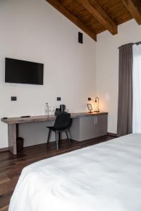 A bed or beds in a room at ORIZZONTI Vigneti Repetto