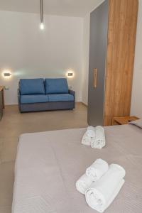 Postel nebo postele na pokoji v ubytování Isgrò Rooms + 37 fotografií