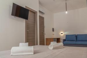 TV a/nebo společenská místnost v ubytování Isgrò Rooms