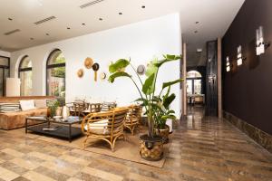 a living room with a couch and a table at Infinity Hotel & More in Budva