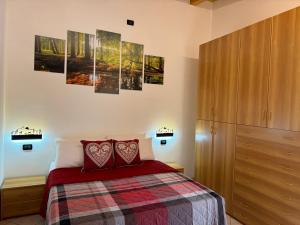 Ένα ή περισσότερα κρεβάτια σε δωμάτιο στο Bilocale baciato dal sole