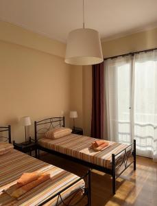Postel nebo postele na pokoji v ubytování Petaluda House 5