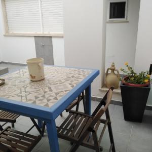 TV a/nebo společenská místnost v ubytování Lentisco B&B