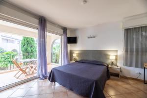 Postel nebo postele na pokoji v ubytování Les Alizés Résidence & Spa + 37 fotografií