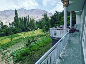 a balcony of a house with a view of the mountains at Alpine Resort Khaplu in Khaplu