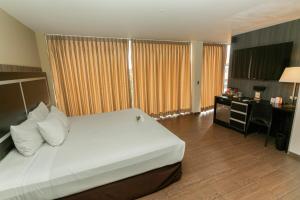Postel nebo postele na pokoji v ubytování Rado Hotel - Santa María