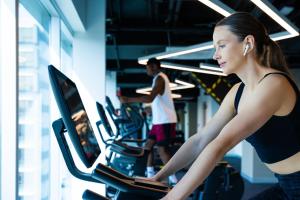 a woman running on a treadmill in a gym at Hyatt Regency Mexico City Insurgentes WTC in Mexico City