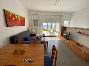 Et opholdsområde på Candela 55 Dúplex con terraza y piscina