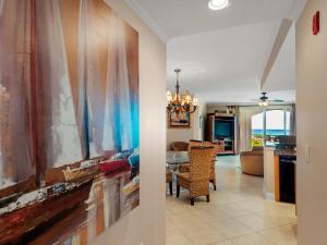 a hallway with a dining room and a living room at San Remo Condominium 201 by Newman-Dailey in Santa Rosa Beach