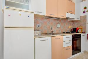 A kitchen or kitchenette at MIO & TUYO CASE VACANZE