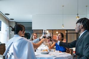a group of people sitting around a table drinking wine at Hyatt Regency Mexico City Insurgentes WTC in Mexico City