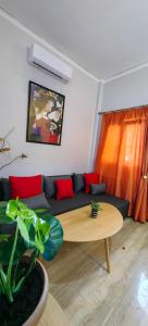 a living room with a couch and a table at Allin home in Mantoúkion