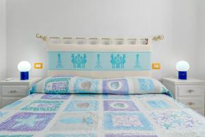 A bed or beds in a room at MIO & TUYO CASE VACANZE