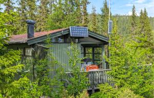 a solar panel on the roof of a cabin at Beautiful Home In Jordet in Jordet +17 photos