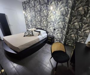 a bedroom with a bed and a table and chairs at B&B Central Vasto in Vasto