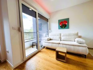 Ένα ή περισσότερα κρεβάτια σε δωμάτιο στο Apartman Anturijum