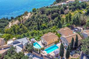 an aerial view of a house with a swimming pool at Villa Maria Vasilikos in Xirokástellon