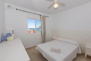 Postel nebo postele na pokoji v ubytování Sun and Seaviews Bay