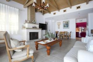 a living room with a couch and a table at dreamOn in Lefkada