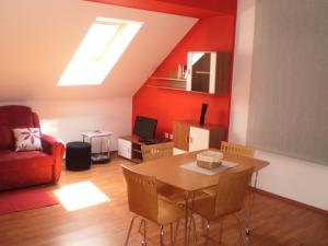 a living room with a table and a couch at Apartments Petar Pan in Krapinske Toplice